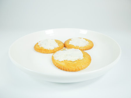 Round crackers with herb cheeseの写真素材