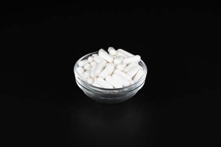 Supplement white tablet black backgroundの写真素材