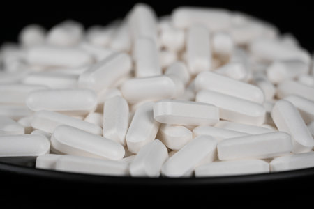 Supplement white tablet black backgroundの写真素材