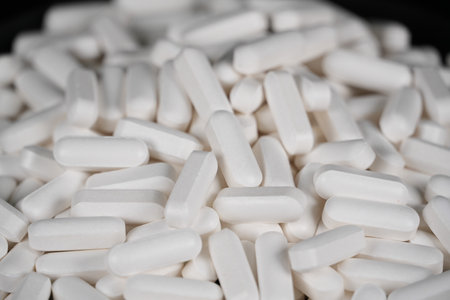 Supplement white tablet black backgroundの写真素材