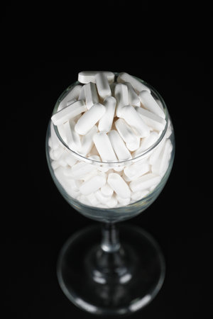 Supplement white tablet black backgroundの写真素材