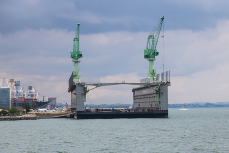CHONBURI, THAILAND - MARCH 20, 2017: Laem Chabang Deep Sea Port Chonburi province For shipping. 
Focusing at crane for container lift up and down cargo ship.のeditorial素材