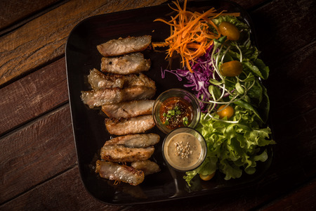 Steak served with vegetable saladの写真素材