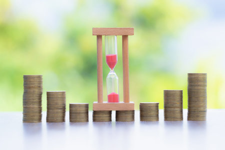 Coin Ladder and Hourglass.Hourglass placed in the middle of the coin And there are coins...