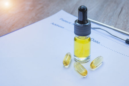 A bottle of hemp oil and tablets extracted from natural herbs. Put on a prescription Medical...