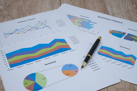 Pen graphs and calculators placed on the table. Concepts Data documents Graphs Graphs Marketing...
