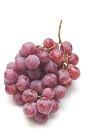 Red grapes isolated on white backgroundの写真素材