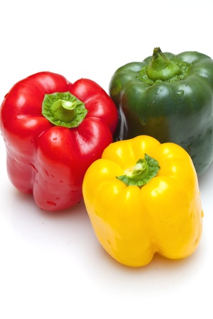 Bell peppers (green, yellow and red) isolated on white backgroundの写真素材