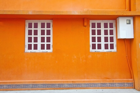 Vintage wall and windows in orange backgroundの写真素材