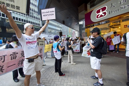 HONG KONG - OCT 21, Occupying Central enters seventh day in Hong Kong on 21 October, 2011. The procession continues to Tai Seng Bank to ask for money refund of Lehman Brothers incident.のeditorial素材