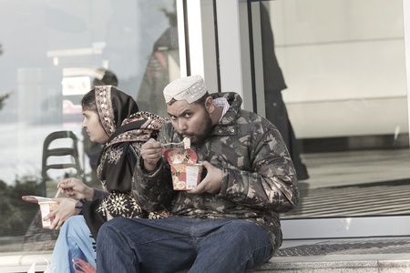 HONG KONG - DEC 10, Minor ethnicity people in Hong Kong eating instant noodles in Hong Kong on 10 December, 2011.のeditorial素材