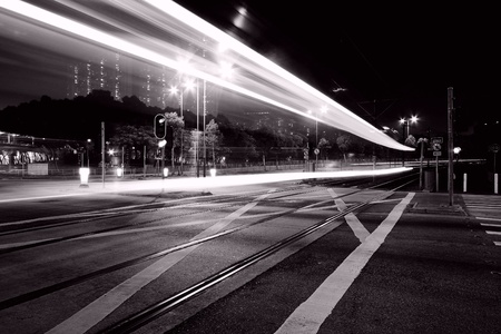 Traffic through downtown of Hong Kong at night in black and whiteの写真素材