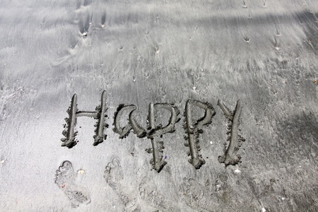 Happy words on sandの写真素材