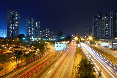 Modern city and traffic at nightの写真素材