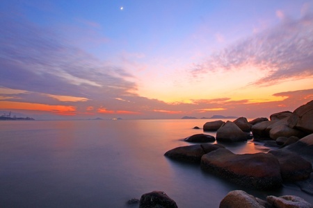 Sunset over the ocean. Nature composition under long exposure.の写真素材