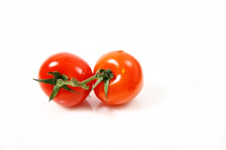 Cherry tomatoes isolated on white backgroundの写真素材