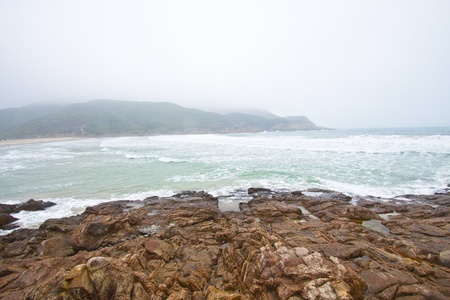 Strong wave along the coast before thunderstorm in Hong Kongの写真素材