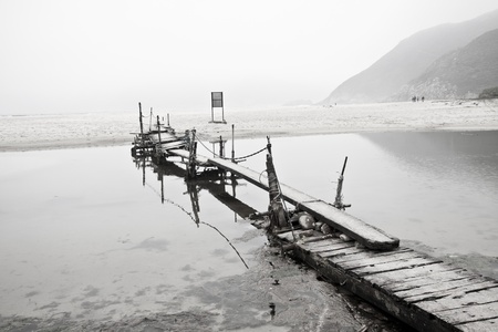 Desolated pier next to the seaの写真素材