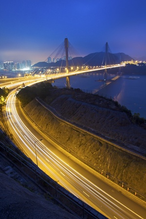 Ting Kau Bridge at night along the highway in Hong Kongの写真素材