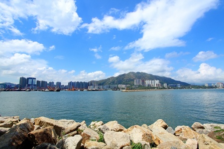 Coastal landscape in Hong Kong at daytime, with many residential buildings. の写真素材