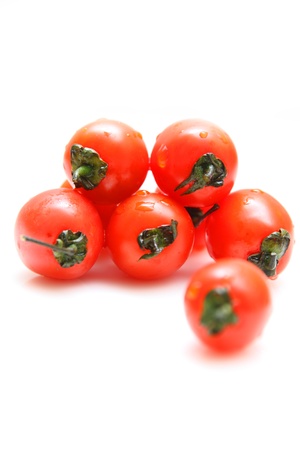 Cherry tomatoes isolated on white backgroundの写真素材