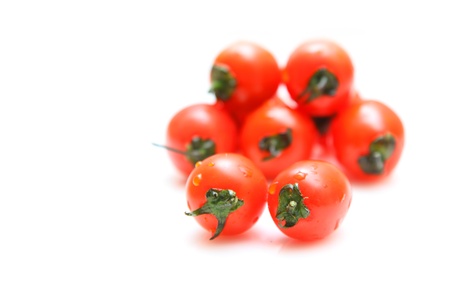 Cherry tomatoes isolated on white backgroundの写真素材