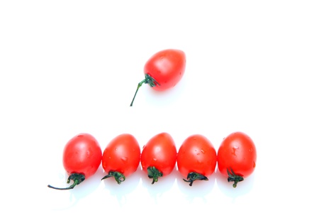 Cherry tomatoes isolated on white backgroundの写真素材