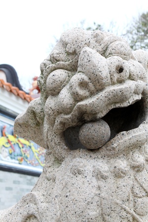 Lion statue outside temple in Hong Kongの写真素材