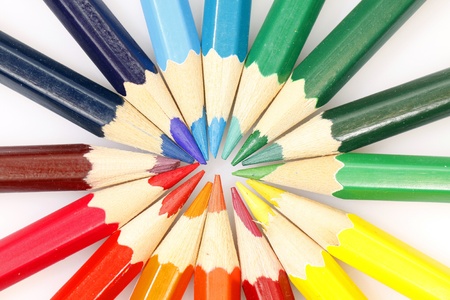 Color pencils in arrange in color wheel colors on white backgroundの写真素材