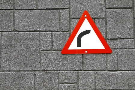 Turn right sign on wallの写真素材