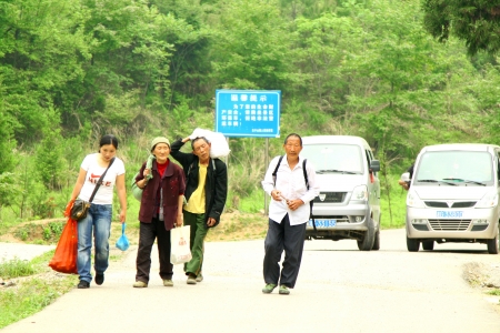 CHINA - MAY 9, Villagers go back home in Zhangjiajie, China on 9 May, 2011. They are famers in countryside.のeditorial素材