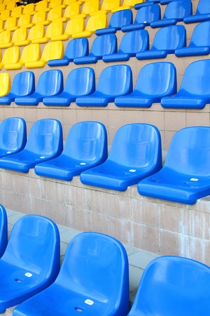 Stadium seats in blue and yellow colorの写真素材