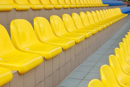 Stadium seats in blue and yellow colorの写真素材