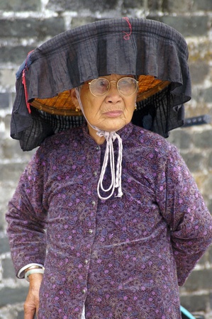 HONG KONG - FEB 22, A Hakka old woman in Kat Hing Wai of Hong Kong on 22 Feburary, 2009. They speak the Cantonese dialect Weitou dialect, rather than Hakka.のeditorial素材