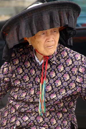HONG KONG - FEB 22, A Hakka old woman in Kat Hing Wai of Hong Kong on 22 Feburary, 2009. They speak the Cantonese dialect Weitou dialect, rather than Hakka.のeditorial素材