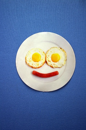 Smiley face on blue backgroundの写真素材