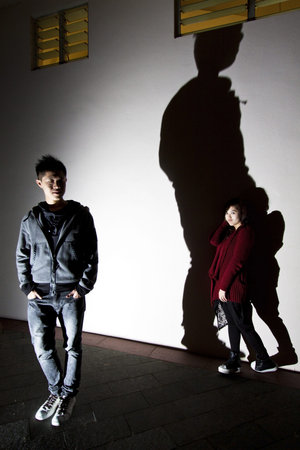 Asian woman and man on streetの写真素材