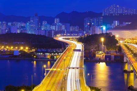 Modern highway in city at nightの写真素材