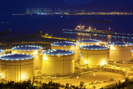 Big Industrial oil tanks in a refinery at nightのeditorial素材