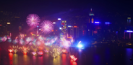 HONG KONG - 1 JANUARY: A splendid firework show and countdown celebration held in Hong Kong on 1 January, 2014. The show lasted for 8 minutes and lighted up the skies above Hong Kong skyscrapers.のeditorial素材
