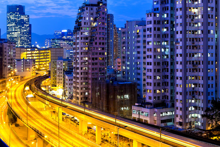 Urban traffic at night with modern buildingsの写真素材