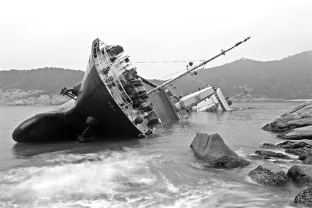 Seascape black and white image of an abandoned shipの写真素材