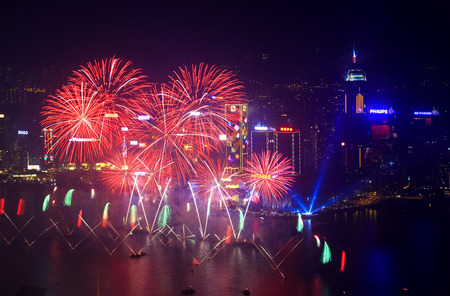 HONG KONG - 1 JANUARY: A splendid firework show and countdown celebration held in Hong Kong on 1 January, 2014. The show lasted for 8 minutes and lighted up the skies above Hong Kong skyscrapers.のeditorial素材