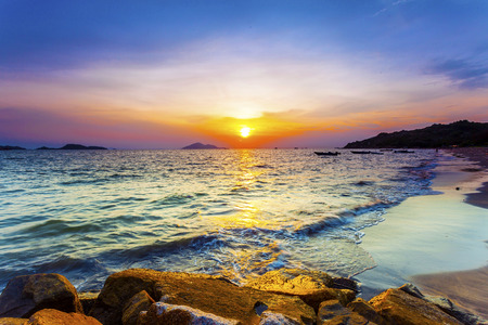 Sunset over the beach with colorful skyの写真素材