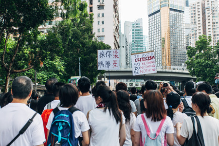HONG KONG - JULY 1: Hong Kong people seek greater democracy as frustration grows over the influence of Beijing on July 1, 2014 in Hong Kong. Organizers of protest claimed a turnout of 510,000 people.のeditorial素材