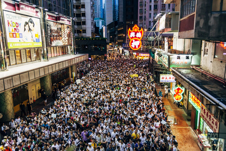 HONG KONG - JULY 1: Hong Kong people seek greater democracy as frustration grows over the influence of Beijing on July 1, 2014 in Hong Kong. Organizers of protest claimed a turnout of 510,000 people.のeditorial素材