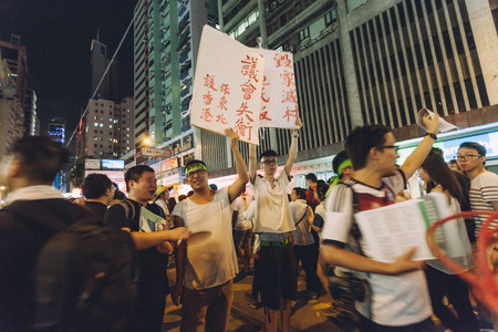 HONG KONG - JULY 1: Hong Kong people seek greater democracy as frustration grows over the influence of Beijing on July 1, 2014 in Hong Kong. Organizers of protest claimed a turnout of 510,000 people.のeditorial素材