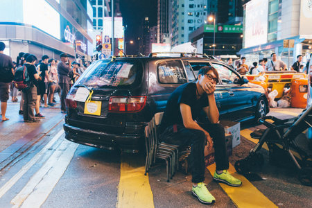 HONG KONG, OCT 1: Crowd of protesters occupy the road in Mongkok on 1 October 2014. Hong Kong people are fighting for a real universal suffrage for the next chief executive election.のeditorial素材