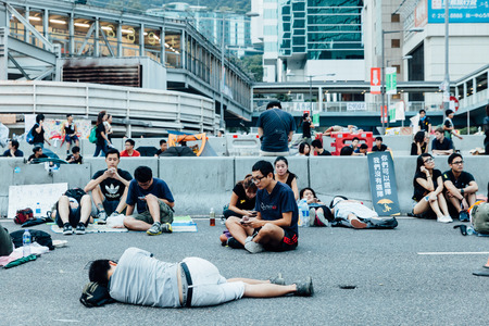 HONG KONG, OCT 2: Crowd of protesters occupy the road in Admiralty on 2 October 2014. Hong Kong people are fighting for a real universal suffrage for the next chief executive election.のeditorial素材