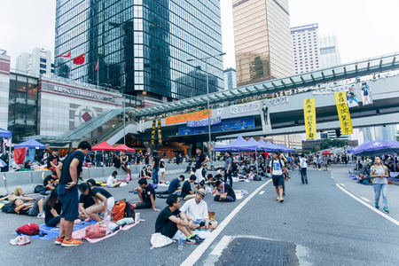HONG KONG, OCT 2: Crowd of protesters occupy the road in Admiralty on 2 October 2014. Hong Kong people are fighting for a real universal suffrage for the next chief executive election.のeditorial素材